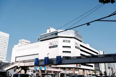 a white building with a sign on the side of it at \u590f\u7f8e\u30db\u30c6\u30eb in Tokyo