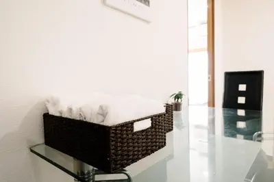 a wicker basket sitting on a glass shelf in a room at \u590f\u7f8e\u30db\u30c6\u30eb in Tokyo
