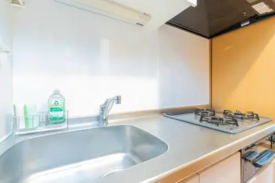 a kitchen with a sink and a stove at Asakusa and Ueno Area, 2 Minutes to Iriya Station, Very Convenient in Tokyo