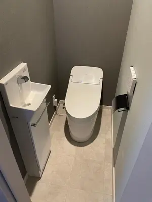 a bathroom with a toilet and a sink at COTO Premium Shibuya A in Tokyo