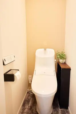 a bathroom with a white toilet in a room at Home Suite Home Ikejiri - Shibuya 1 Stop! Sleek Confort with Washer and Dryer in Tokyo