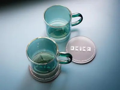 a cup of water next to a coin next to it at OCICA OSHIAGE TOKYO by R HOTEL in Tokyo