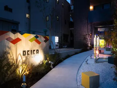 a walkway in front of a building at night at OCICA OSHIAGE TOKYO by R HOTEL in Tokyo