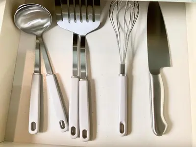 a group of silver utensils in a drawer at MIKO'S HOUSE SETAGAYA, Peaceful Tokyo Home Near Shinjuku, Experience Authentic Local Living, Lucky Cat Temple, Super Market 東京の家 新宿10分 隠れ家カフェ 豪徳寺 in Tokyo