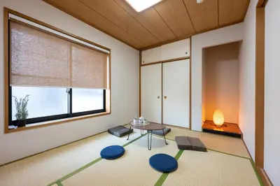 a room with a table and chairs and a window at YJ-HOTEL kamiikebukuro 2F \u5317\u6c60\u888b5\u5206\u949f \u65b0\u88c5\u4e0a\u7ebf 59\u5e73\u65b9 in Tokyo