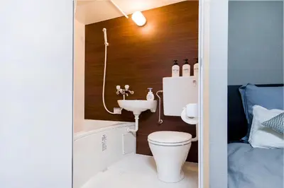 a small bathroom with a toilet and a sink at CG Charming Guesthouse in the Heart of Okubo \u4e36Steps to Metro and Convenient Travel! SoS4 in Tokyo