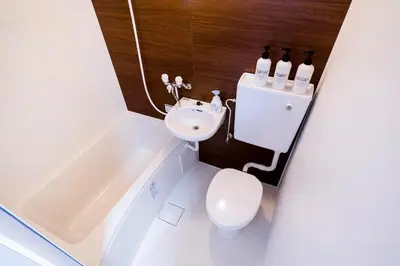 a bathroom with a sink and a toilet and a tub at CG Charming Guesthouse in the Heart of Okubo \u4e36Steps to Metro and Convenient Travel! SoS4 in Tokyo