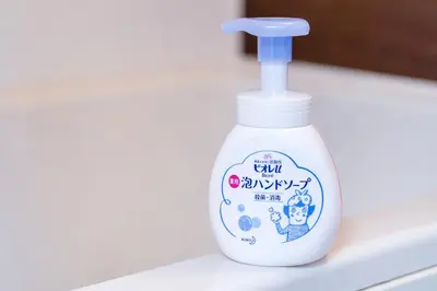a bottle of liquid detergent sitting on a kitchen counter at CG Charming Guesthouse in the Heart of Okubo \u4e36Steps to Metro and Convenient Travel! SoS4 in Tokyo