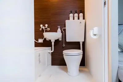 a small bathroom with a toilet and a sink at CG Charming Guesthouse in the Heart of Okubo \u4e36Steps to Metro and Convenient Travel! SoS4 in Tokyo
