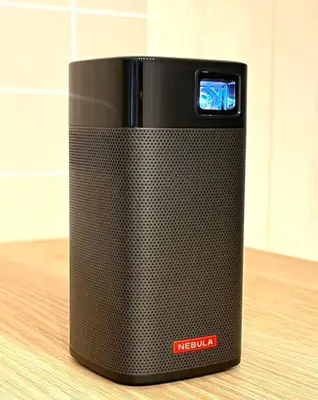 a black speaker sitting on top of a table at 2 Minutes Walk to Ikebukuro Station, Central Tokyo and Very Convenient in Tokyo