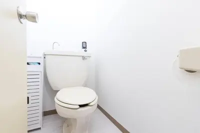 a bathroom with a white toilet in a room at 2 Minutes Walk to Ikebukuro Station, Central Tokyo and Very Convenient in Tokyo