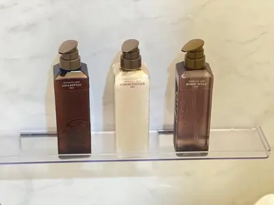 three bottles of soap on a glass shelf at \u65b0\u5bbf16 Shinjuku16 in Tokyo
