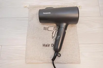 a hair drier sitting on top of a towel at \u65b0\u5bbf16 Shinjuku16 in Tokyo