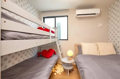 a bedroom with bunk beds and a bunk bed at Skytree View Terrace in Tokyo