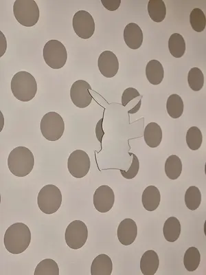 a stencil of a cow on a polka dot pattern at Skytree View Terrace in Tokyo