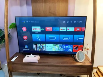 a flat screen tv sitting on a wooden table at \u67f4\u53c81\u4e01\u76ee in Tokyo