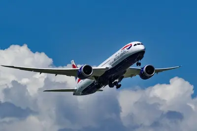 a plane is flying in the sky at \u67f4\u53c81\u4e01\u76ee in Tokyo