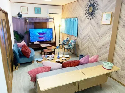 a living room with a couch and a tv at \u67f4\u53c81\u4e01\u76ee in Tokyo