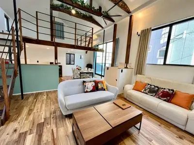 a living room with a couch and a table at House22 -Brand new house in Tokyo