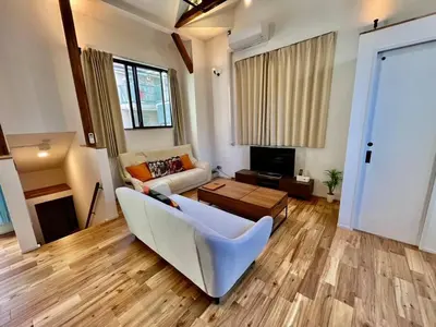a living room with a couch and a table at House22 -Brand new house in Tokyo