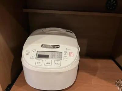 a small washing machine sitting in the corner of a room at House22 -Brand new house in Tokyo