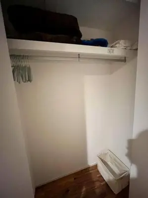 a room with a closet with a shelf and a wooden floor at House22 -Brand new house in Tokyo