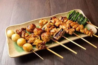a plate of food with shrimp and vegetables on skewers at House22 -Brand new house in Tokyo