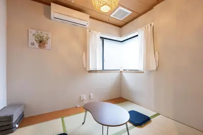 a room with a white table and a window at YJ-HOTEL kamiikebukuro 3F \u5317\u6c60\u888b5\u5206\u949f \u65b0\u88c5\u4e0a\u7ebf 61\u5e73\u65b9 in Tokyo