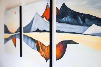 a group of paintings hanging on a wall at \u672c\u753a2\u4e01\u76ee in Tokyo