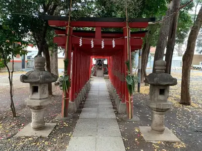 a red archway with a red curtain and trees at \u672c\u753a2\u4e01\u76ee in Tokyo