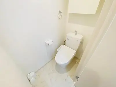 a bathroom with a white toilet in a room at QH102, Newly renovated hotel, direct access to Ueno, Asakusa, Disneyland, Airport in Tokyo