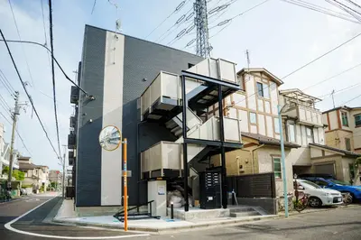 a building with a spiral staircase on the side of it at QH102, Newly renovated hotel, direct access to Ueno, Asakusa, Disneyland, Airport in Tokyo