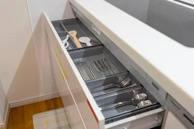 an open drawer in a kitchen with silver utensils at Kita-Akabane - Diamond Yu in Tokyo