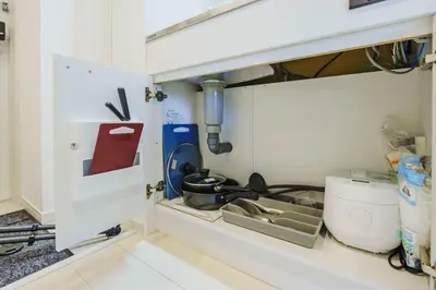 a kitchen with a sink and a stove at QH302, Newly renovated hotel, direct access to Ueno, Asakusa, Disneyland, Airport in Tokyo