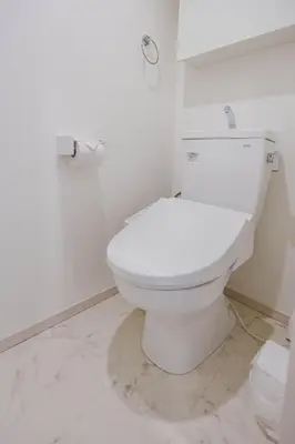 a bathroom with a white toilet in a room at QH302, Newly renovated hotel, direct access to Ueno, Asakusa, Disneyland, Airport in Tokyo