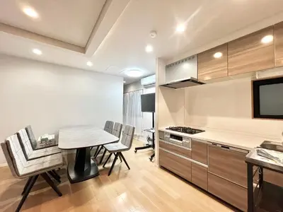 a kitchen and dining room with a table and chairs at Kenki Torigoe House-TT0173 in Tokyo