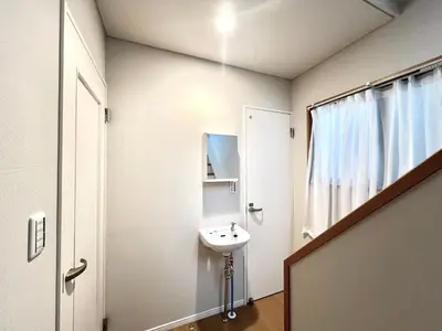 a bathroom with a sink and a mirror at Kenki Torigoe House-TT0173 in Tokyo
