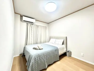 a bedroom with a bed with a stuffed animal on it at Kenki Torigoe House-TT0173 in Tokyo