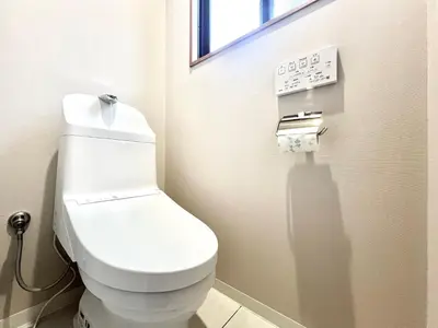 a white toilet in a bathroom with a window at Kenki Torigoe House-TT0173 in Tokyo