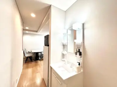 a white bathroom with a sink and a mirror at Kenki Torigoe House-TT0173 in Tokyo