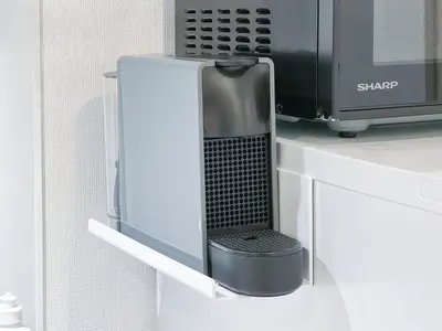 a microwave oven sitting on top of a counter at Triphome Higahsi Shinjuku Brand New in Tokyo