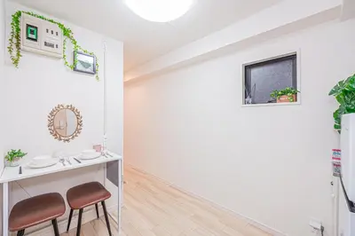 a bathroom with a vanity and stools in a room at \u65b0\u5bbf\u5e02\u4e2d\u5fc3\u6b4c\u821e\u4f0e\u5ba2\u623f\u6e90\u51fa\u884c\u4fbf\u5229\u514d\u8d39Wi-Fi in Tokyo