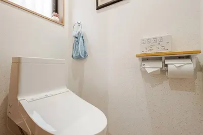 a bathroom with a white toilet in a room at \u706f\u5149\u65c5\u9928-\u9ad8\u7802 in Tokyo