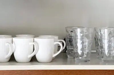 a row of glass cups and vases on a shelf at \u30e1\u30be\u30f3\u30c9\u30df\u30ca301 in Tokyo