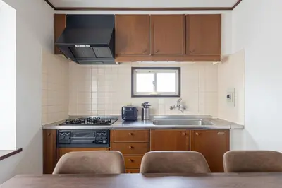 a small kitchen with a sink and a stove at \u30e1\u30be\u30f3\u30c9\u30df\u30ca301 in Tokyo