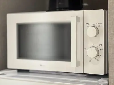 a microwave oven sitting on top of a counter at Shinjuku Waseda Hostel-SJ0147 in Tokyo