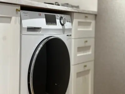 a white washing machine sitting in a kitchen at Shinjuku Waseda Hostel-SJ0147 in Tokyo