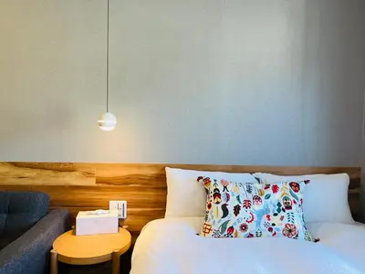 a bedroom with a bed and a couch and a table at Shinjuku Waseda Hostel-SJ0147 in Tokyo