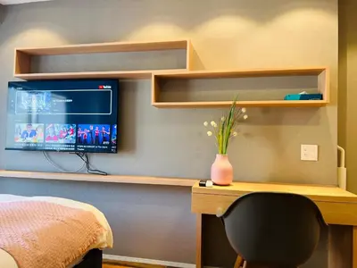 a bedroom with a desk with a computer and a monitor at Shinjuku Waseda Hostel-SJ0147 in Tokyo