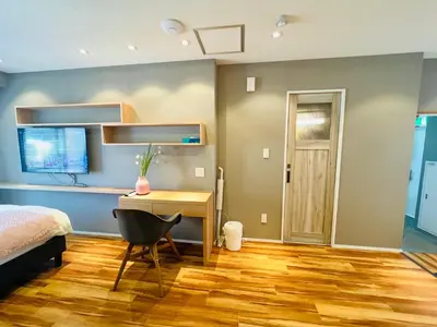 a bedroom with a desk and a bed at Shinjuku Waseda Hostel-SJ0147 in Tokyo